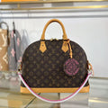 26S ALMA DRAWSTRING BAG IN MONOGRAM CANVAS WITH NATURAL COWHIDE LEATHER